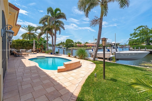 1437 SE 13th St, Deerfield Beach, FL 33441 - outdoor pool featuring a patio, a boat dock, a water view, a lawn, and boat lift
