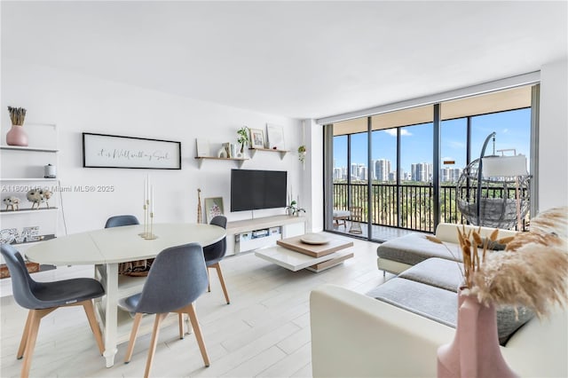 20379 W Country Club Dr Unit 1237, Aventura, FL 33180 - living room featuring a wall of windows and light wood-style floors