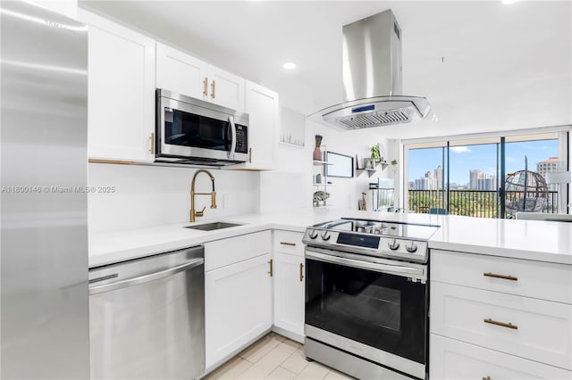 20379 W Country Club Dr Unit 1237, Aventura, FL 33180 - kitchen with stainless steel appliances, island range hood, light countertops, white cabinets, and recessed lighting