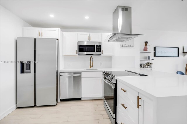 20379 W Country Club Dr Unit 1237, Aventura, FL 33180 - kitchen featuring appliances with stainless steel finishes, island range hood, white cabinetry, a peninsula, and recessed lighting