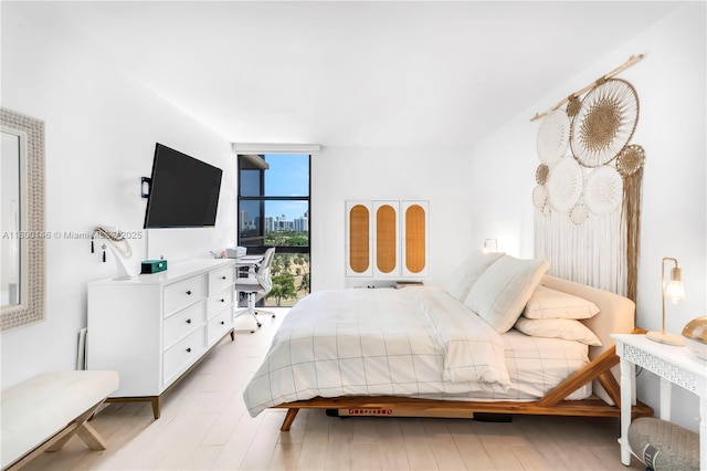 20379 W Country Club Dr Unit 1237, Aventura, FL 33180 - bedroom with a wall of windows and light wood-style floors