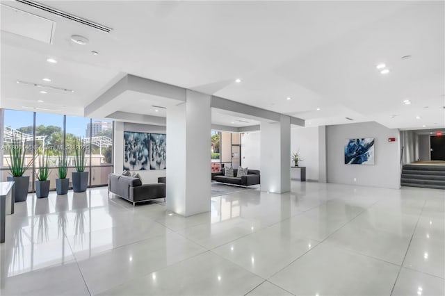 20379 W Country Club Dr Unit 1237, Aventura, FL 33180 - community lobby featuring a wall of windows, stairs, and recessed lighting