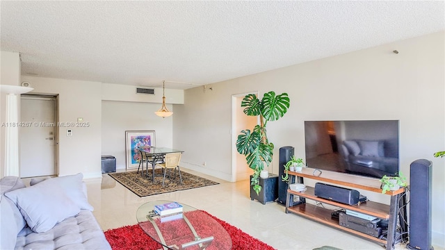 20355 NE 34th Ct Unit 325, Aventura, FL 33180 - living room featuring a textured ceiling