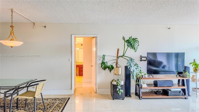 20355 NE 34th Ct Unit 325, Aventura, FL 33180 - living area featuring a textured ceiling and baseboards