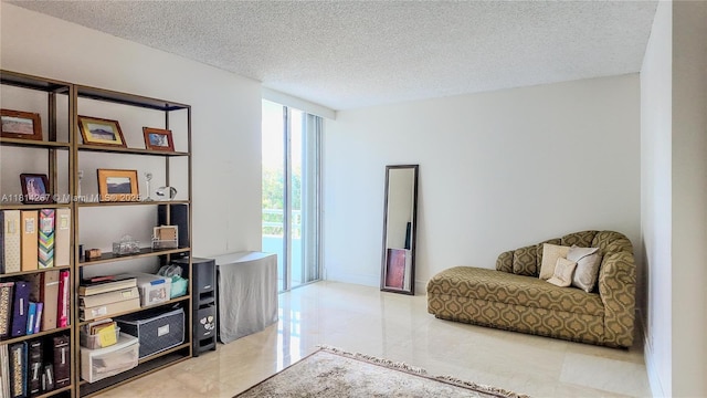 20355 NE 34th Ct Unit 325, Aventura, FL 33180 - living area featuring a textured ceiling