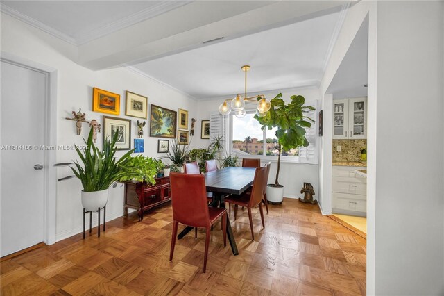 2825 Granada Blvd Unit 3B, Coral Gables, FL 33134 - dining room with a chandelier and ornamental molding