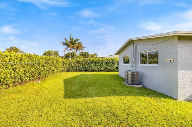 2111 NE 14th Ct, Hollywood, FL 33020 - view of grassy yard with central AC unit
