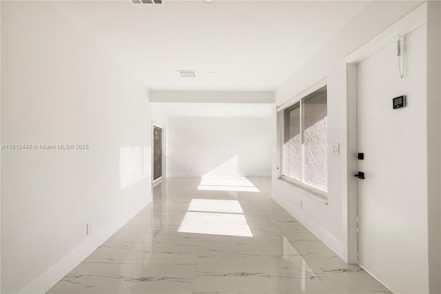 2111 NE 14th Ct, Hollywood, FL 33020 - hallway featuring baseboards and marble finish flooring