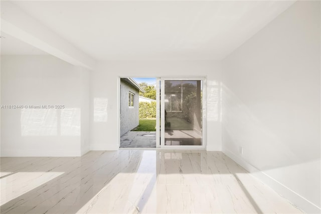 2111 NE 14th Ct, Hollywood, FL 33020 - empty room with baseboards and marble finish flooring
