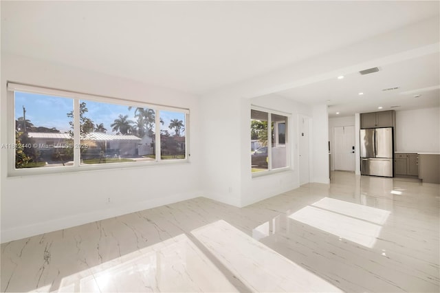 2111 NE 14th Ct, Hollywood, FL 33020 - spare room featuring baseboards, light marble finish flooring, and recessed lighting