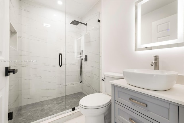 2111 NE 14th Ct, Hollywood, FL 33020 - bathroom featuring a marble finish shower, vanity, and toilet