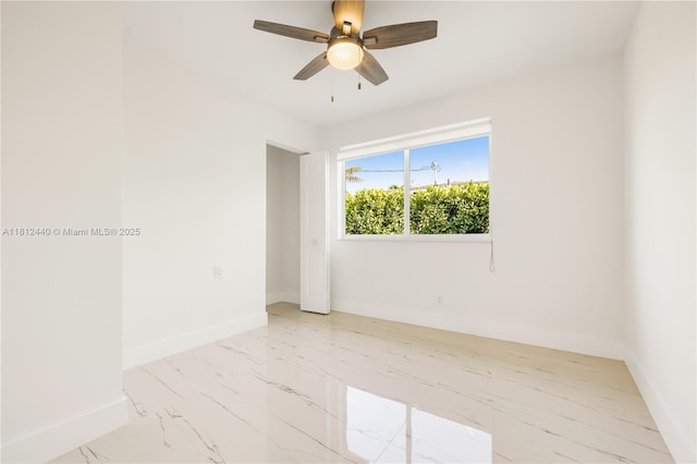 2111 NE 14th Ct, Hollywood, FL 33020 - empty room featuring baseboards, ceiling fan, and marble finish floors