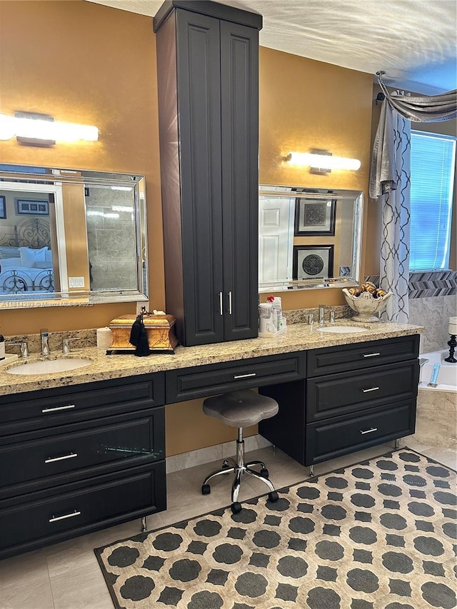 5320 SW 130th Ter, Miramar, FL 33027 - bathroom featuring double vanity, a tub to relax in, and tile patterned flooring