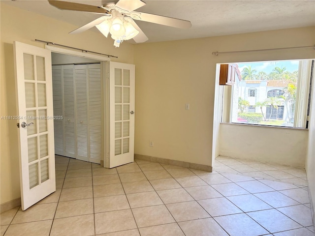 3564 Magellan Cir Unit 213-1, Aventura, FL 33180 - unfurnished room featuring french doors, light tile patterned floors, and ceiling fan