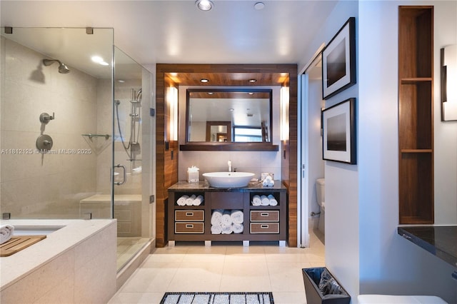 6801 Collins Ave Unit 510Door 512, Miami Beach, FL 33141 - full bathroom featuring a shower stall, vanity, and tile patterned floors