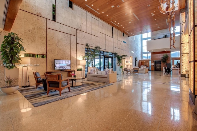 6801 Collins Ave Unit 510Door 512, Miami Beach, FL 33141 - community lobby with a towering ceiling, wood ceiling, and recessed lighting
