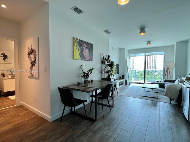 1600 SW 1st Ave Unit 813, Miami, FL 33129 - dining area featuring dark wood-style floors and baseboards