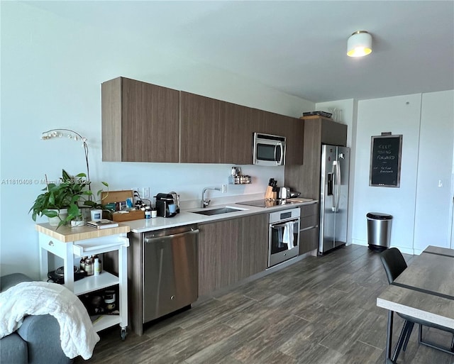 1600 SW 1st Ave Unit 813, Miami, FL 33129 - kitchen featuring appliances with stainless steel finishes, a sink, light countertops, dark wood-type flooring, and modern cabinets