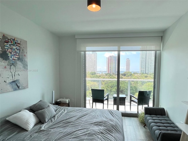 1600 SW 1st Ave Unit 813, Miami, FL 33129 - bedroom featuring wood finished floors and a city view