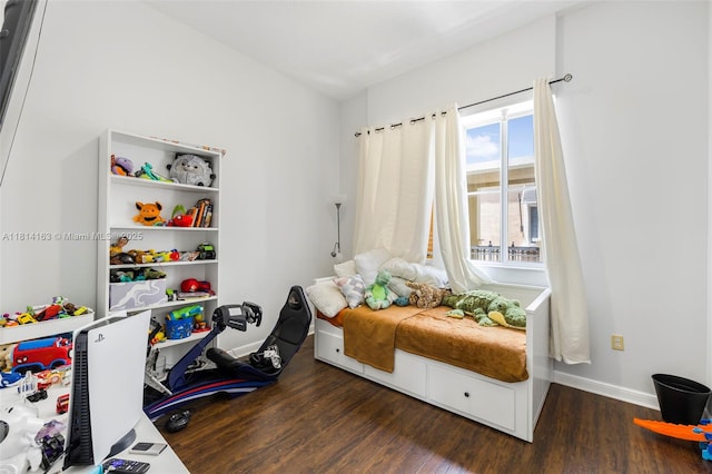 3055 NW 126th Ave Unit 303, Sunrise, FL 33323 - bedroom featuring wood finished floors and baseboards