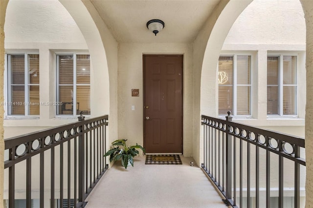 3055 NW 126th Ave Unit 303, Sunrise, FL 33323 - property entrance featuring stucco siding and a balcony