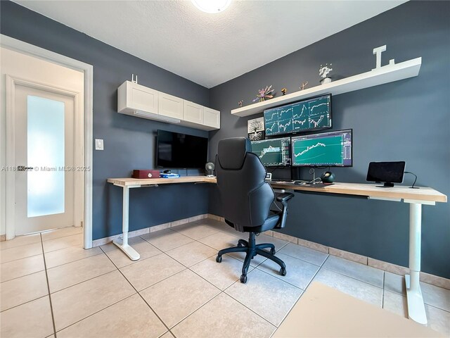 14751 SW 158th St, Miami, FL 33187 - home office with built in study area, baseboards, light tile patterned floors, and a textured ceiling