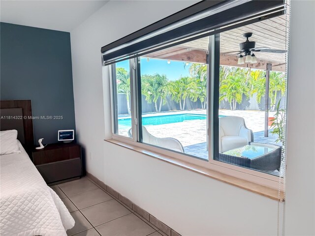 14751 SW 158th St, Miami, FL 33187 - bedroom featuring multiple windows, light tile patterned floors, and baseboards