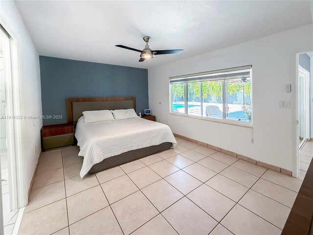 14751 SW 158th St, Miami, FL 33187 - bedroom with light tile patterned floors, ceiling fan, and baseboards