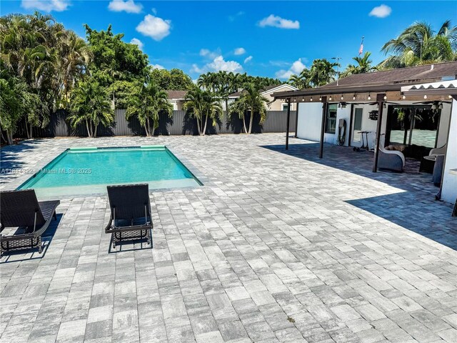 14751 SW 158th St, Miami, FL 33187 - view of swimming pool with a fenced backyard and a patio