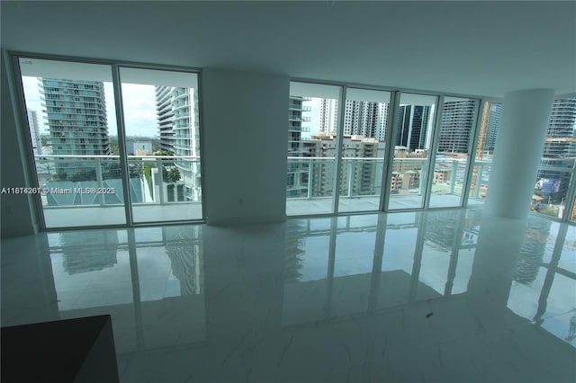 1080 Brickell Ave Unit 1409, Miami, FL 33131 - empty room with a wall of windows and a view of city
