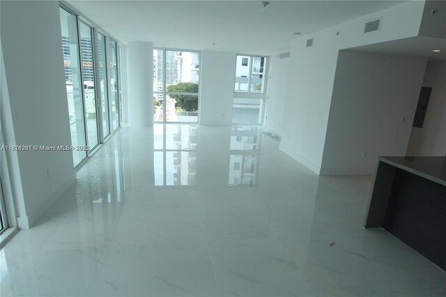 1080 Brickell Ave Unit 1409, Miami, FL 33131 - spare room with expansive windows and light marble finish floors