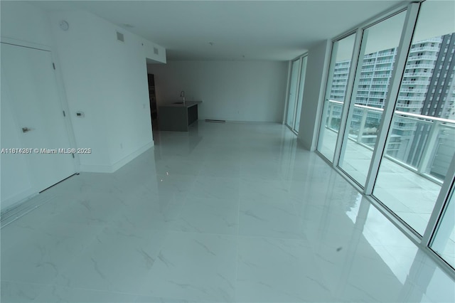 1080 Brickell Ave Unit 1409, Miami, FL 33131 - unfurnished room featuring a wall of windows and a sink