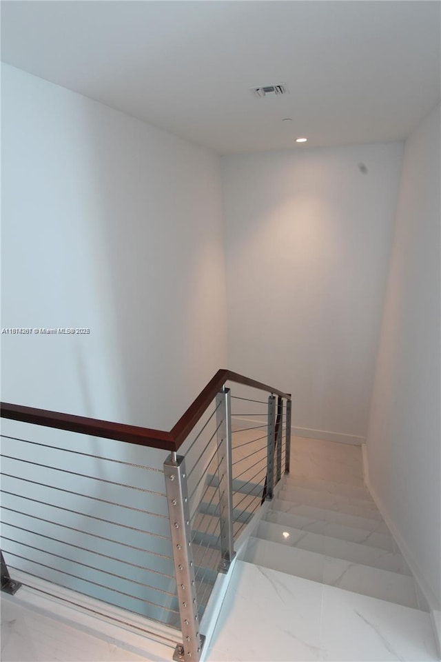 1080 Brickell Ave Unit 1409, Miami, FL 33131 - stairs featuring baseboards, recessed lighting, and marble finish floors