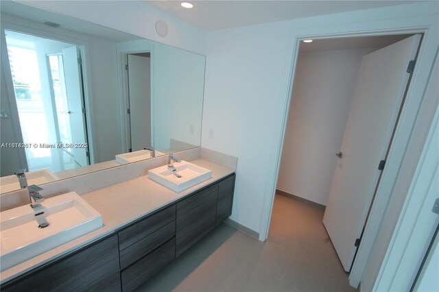 1080 Brickell Ave Unit 1409, Miami, FL 33131 - full bath featuring double vanity, recessed lighting, and baseboards