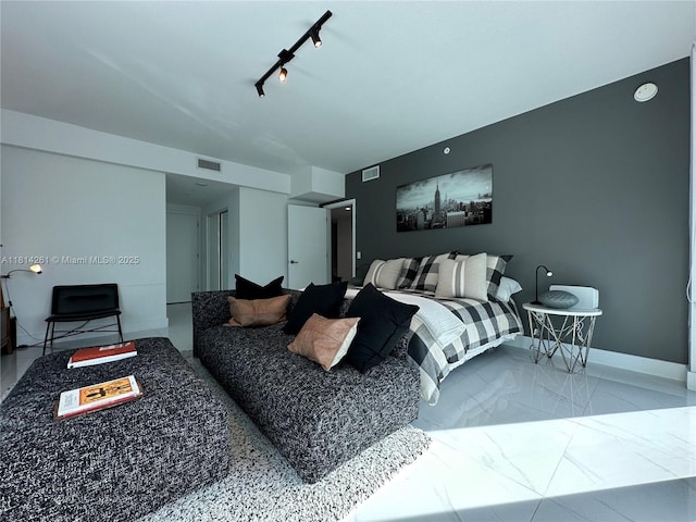 1080 Brickell Ave Unit 1409, Miami, FL 33131 - bedroom with rail lighting and baseboards