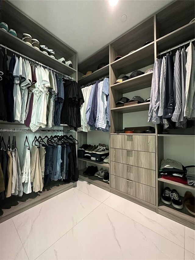 1080 Brickell Ave Unit 1409, Miami, FL 33131 - walk in closet featuring marble finish flooring