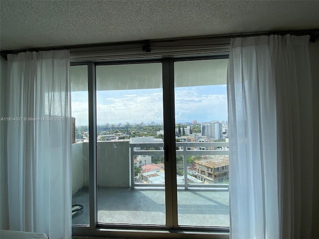 1500 Bay Rd Unit 1274S, Miami Beach, FL 33139 - doorway to outside with a city view and a textured ceiling