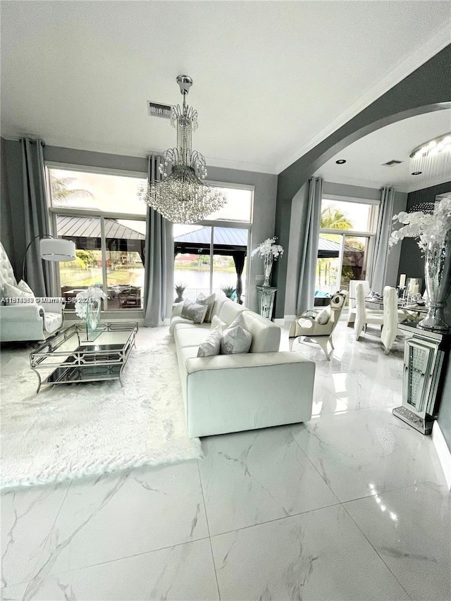 4248 SW 185th Ave, Miramar, FL 33029 - living area with marble tiled floors, arched walkways, and healthy amount of natural light
