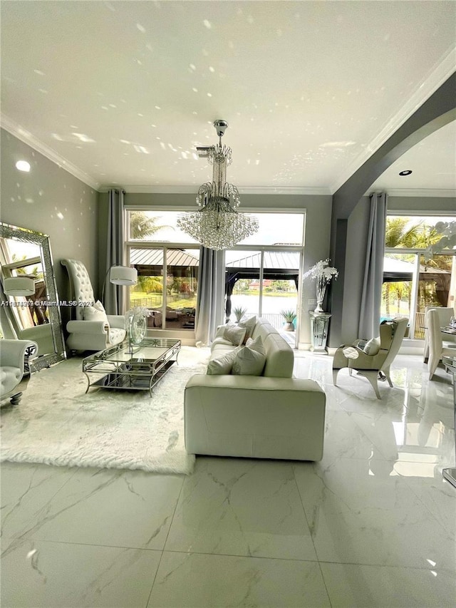 4248 SW 185th Ave, Miramar, FL 33029 - living room with ornamental molding, arched walkways, marble finish flooring, a chandelier, and healthy amount of natural light