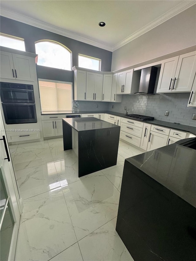 4248 SW 185th Ave, Miramar, FL 33029 - kitchen featuring ornamental molding, wall chimney range hood, tasteful backsplash, a center island, and dark countertops