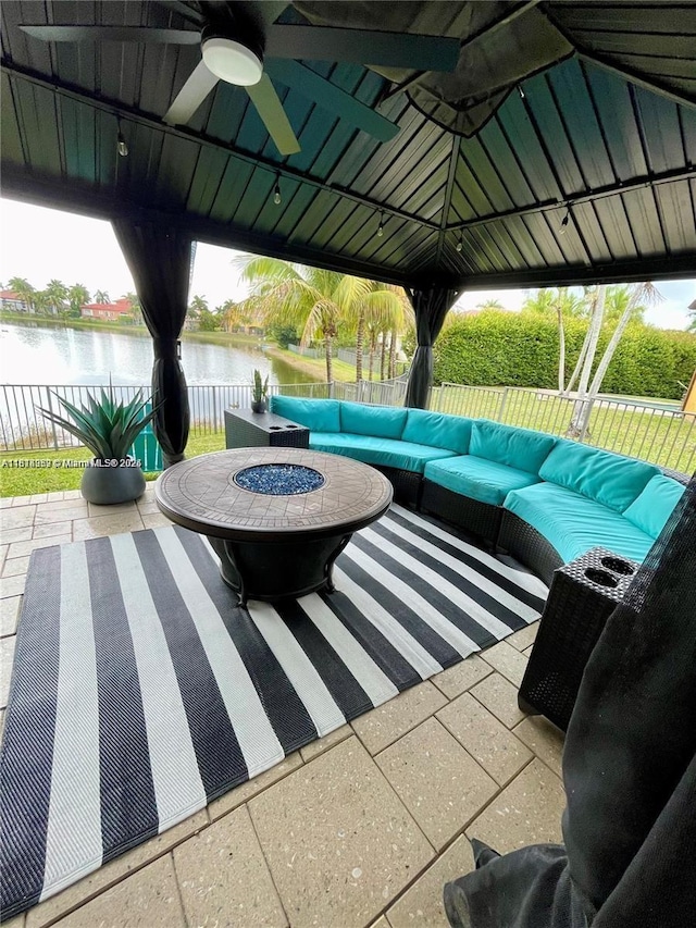 4248 SW 185th Ave, Miramar, FL 33029 - fenced backyard with a water view, a gazebo, ceiling fan, a patio, and an outdoor living space with a fire pit