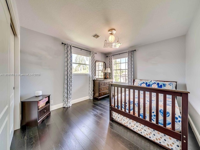 4248 SW 185th Ave, Miramar, FL 33029 - bedroom with baseboards, dark wood-style floors, and a textured ceiling
