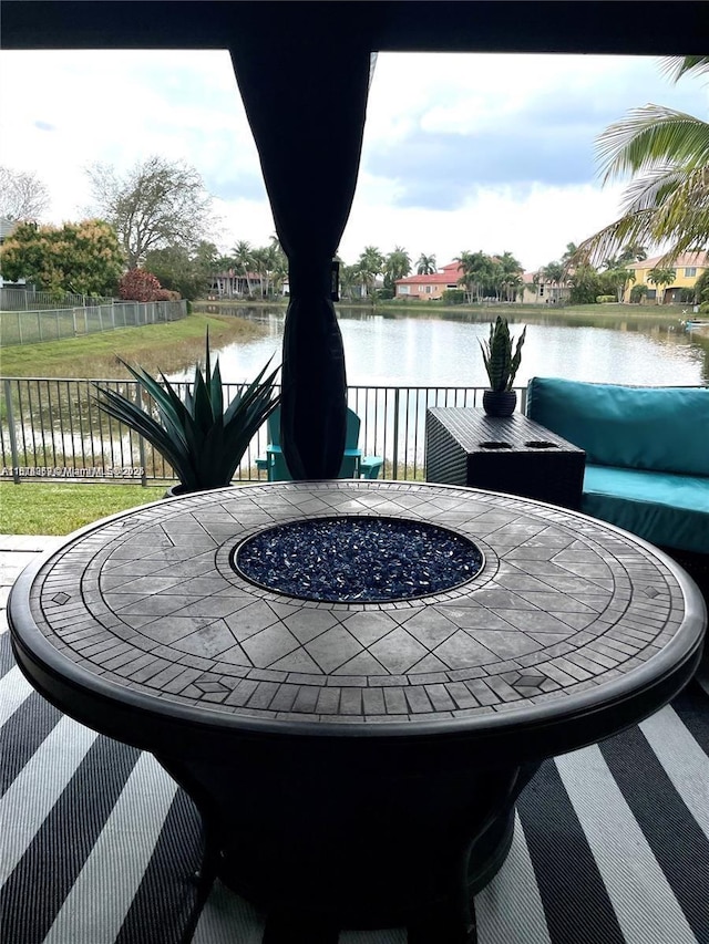 4248 SW 185th Ave, Miramar, FL 33029 - view of patio / terrace with an outdoor fire pit and a water view