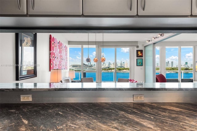 540 W Ave Unit 914, Miami Beach, FL 33139 - detailed view of dark stone countertops, a large body of water, and skyline