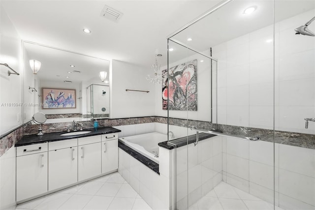 540 W Ave Unit 914, Miami Beach, FL 33139 - full bathroom with vanity, a shower stall, a bath, recessed lighting, and tile patterned floors
