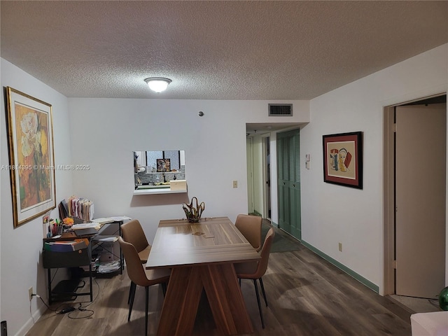 4820 W Lucerne Lakes Blvd W Unit 305, Lake Worth, FL 33467 - dining area featuring wood finished floors, a textured ceiling, and baseboards
