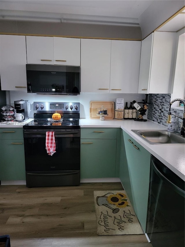4820 W Lucerne Lakes Blvd W Unit 305, Lake Worth, FL 33467 - kitchen with electric range oven, black microwave, dishwasher, a sink, and light countertops