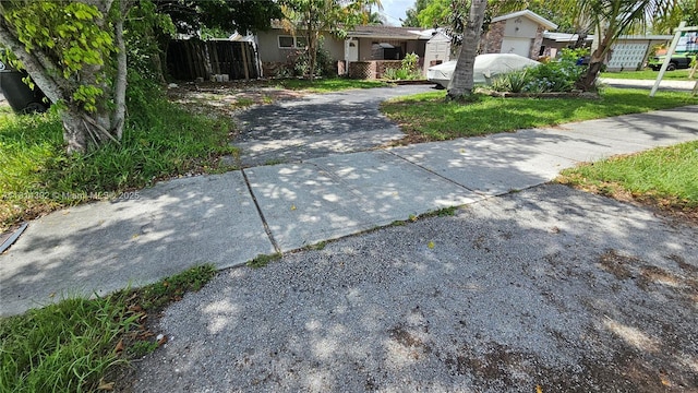 3390 SW 15th Ct, Fort Lauderdale, FL 33312 - view of front facade with driveway and stucco siding