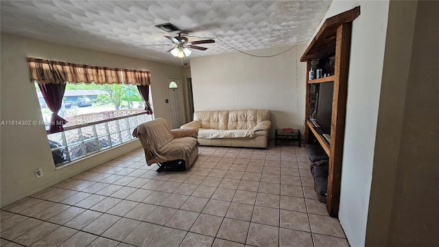 3390 SW 15th Ct, Fort Lauderdale, FL 33312 - living area with a ceiling fan, light tile patterned floors, and a textured ceiling