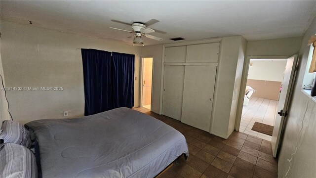 3390 SW 15th Ct, Fort Lauderdale, FL 33312 - tiled bedroom featuring a closet and ceiling fan